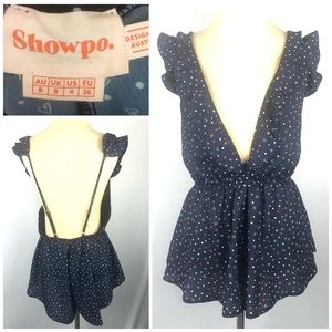 Showpo. Short backless navy Ruffle romper sz 4